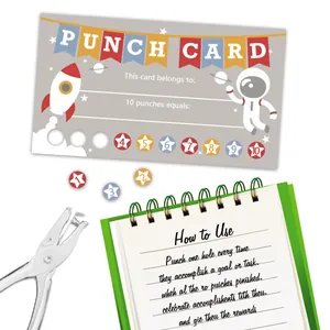 Detail of space-themed reward punch cards for kids with star slots and metal puncher tool