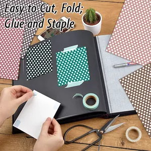Polka dot decorative paper set for DIY scrapbooking and crafts on wooden desk