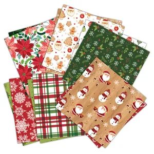 Detailed view of Christmas themed scrapbook paper set with festive patterns for DIY crafts