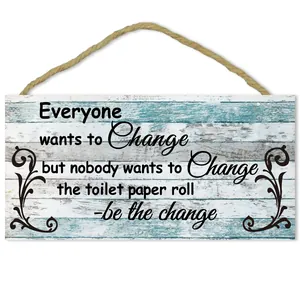 Detail of rustic wooden bathroom wall plaque with blue shaby wood grain and twine