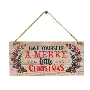 Detail eines quadratischen Weihnachtsholzschilds mit Gruß und rustikalem Hanfseil