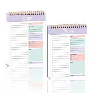 Dettaglio dell'agenda giornaliera a spirale con stampa fronte-retro e layout funzionali