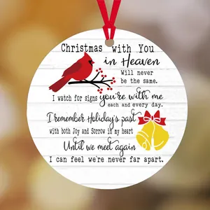 Memorial Christmas cardinal ornament with wood grain texture and festive red ribbon hanging