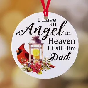 Memorial Christmas ornament featuring a red cardinal, kerosene lamp, and sentimental text