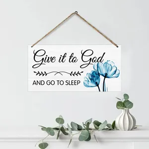 Detail of wooden wall sign with blue tulips and Give it to God inspirational quote