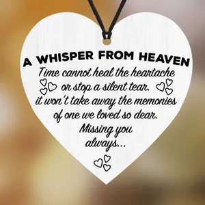 White heart-shaped wooden commemorative plaque with black memorial poem and hanging rope
