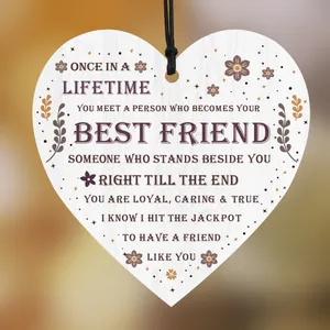 Heart-shaped wooden Christmas ornament with friendship quote and natural texture