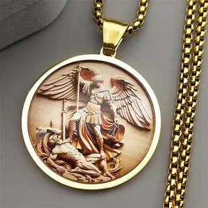 Detailed close-up of golden Archangel Michael medallion on a high-quality box chain necklace