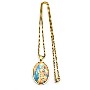 Detail view of Virgin Mary and Child oval pendant with gold bead chain necklace