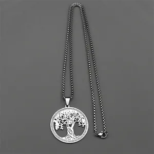 Detailed close-up of a silver hollow tree of life pendant on a sleek metal box chain