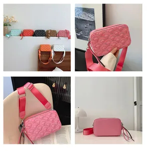 Detail of fish scale quilted PU leather crossbody bag with wide woven strap and zipper