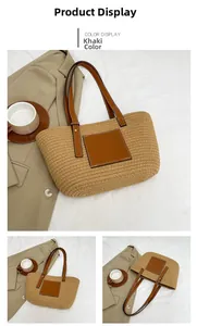 Detail of khaki straw woven tote bag with brown leather handles and a square front pocket