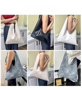Collage showing oversized faux leather tote bags in four colors with rivet corner detail