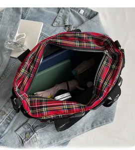 Top view of red plaid tote bag interior showing large capacity and black fabric lining