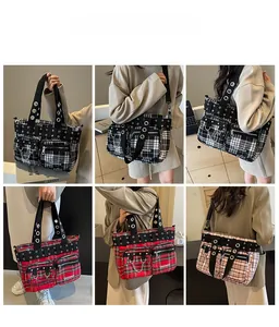 Detail of retro plaid tote bags with punk metal chains and eyelets in multiple colors