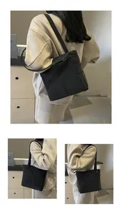 Dettaglio della borsa a spalla in nylon trapuntato nero con cuciture e trama imbottita