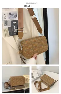 Detail of khaki PU leather crossbody bag with rainbow fish scale embroidery and silver zipper