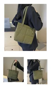 Dettaglio macro della borsa tote trapuntata verde oliva con cuciture e trama in nylon