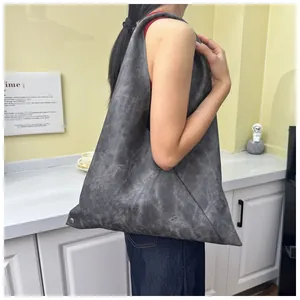 Detailed view of the dark grey soft leather shoulder bag showing large capacity and texture