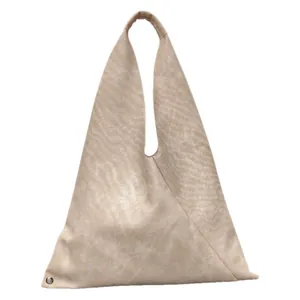 Minimalist triangle hobo bag in soft champagne gold leather with metallic texture