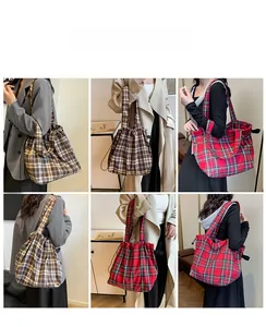 Detailed views of checkered drawstring tote bags in brown and red vintage plaid patterns