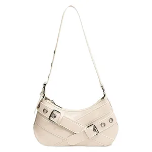 Elegant off-white half-moon underarm bag with silver grommets and cross strap details