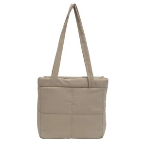 Minimalist padded quilted tote bag in light khaki with puffer design and twin shoulder straps