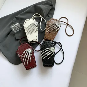 Gothic coffin-shaped PU shoulder bag with 3D bone hand decoration and skull embossing