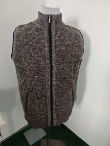 Detailed view of men's knitted zip vest with stand collar, ribbed hem, and side pockets