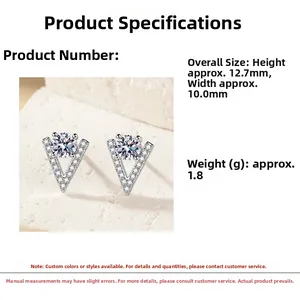 Macro detail of V-shaped silver earrings with brilliant cut cubic zirconia stones