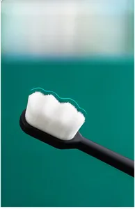 Close-up of soft micro-nano bristles with a wavy curve design on a black handle brush