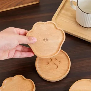 Handcrafted beech wood coaster set featuring cute bear paw designs for coffee cups
