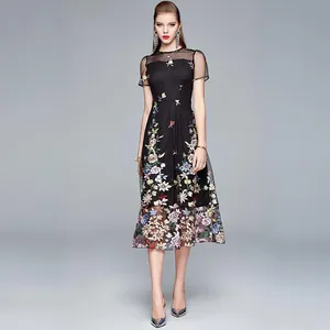 Elegant black A-line dress with colorful floral embroidery and sheer mesh splicing details