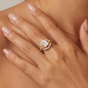 Detail of emerald cut 3 carat zircon crown wedding ring set on hand in gold plating