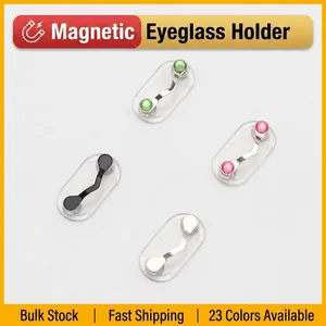 Magnetic eyeglass holder in silver, black, and gemstone styles on a neutral background
