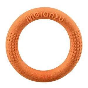 Orange TPR dog training ring toy with textured floating surface for dental massage