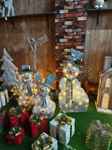 Three-piece LED light-up snowman set with plush white fabric and festive plaid scarves