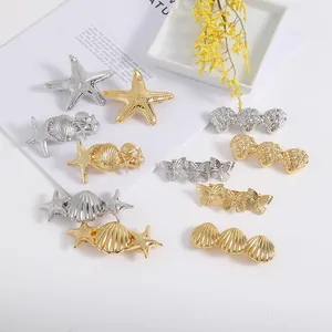 Irregular geometric bow and shell metal hair clips set in gold and silver plating