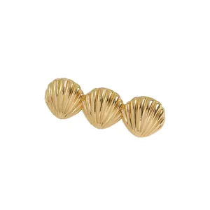 Elegant gold scallop shell hair clip with irregular textured metallic finish for women