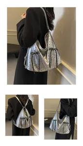 Detail of silver polka dot tote bag showing shoulder and backpack wear modes with bow accent