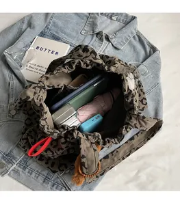 Detailed interior of leopard canvas tote bag showing large capacity for daily items