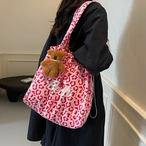 Pink leopard print canvas tote bag with Beach text and plush bear charm for daily use