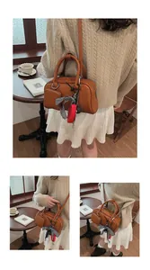 Brown vintage faux leather crossbody bag with checkered ribbon and mini pouch accessory