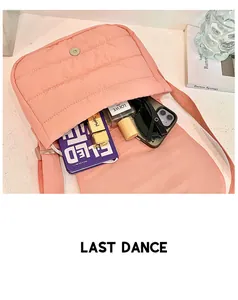 Pink quilted shoulder bag interior showing large capacity for cosmetics and notebooks