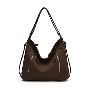 Grand sac cabas vintage marron foncé avec deux poches zippées et une finition mate
