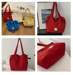 Macro detail of quilted nylon tote bag with drawstring closure and brand label