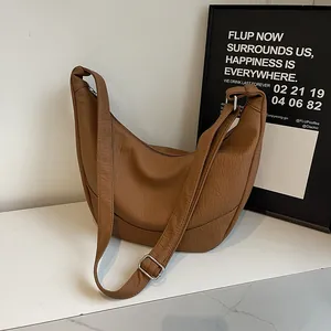 Chic caramel brown crescent moon shoulder bag in lychee pattern PU leather