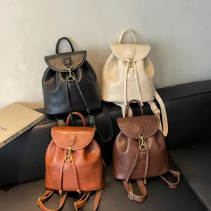 Detailed view of vintage faux leather backpacks in four colors with metal buckles