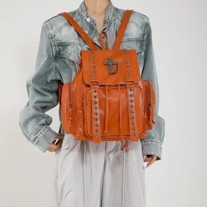 Orange faux leather backpack with metallic cross pendant and rivet studs for women