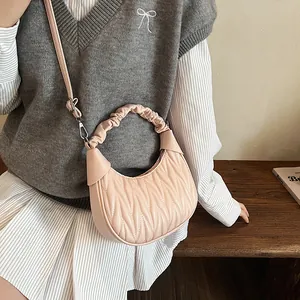 Chic beige crescent hobo bag with pleated texture and stylish scrunchie handle for women